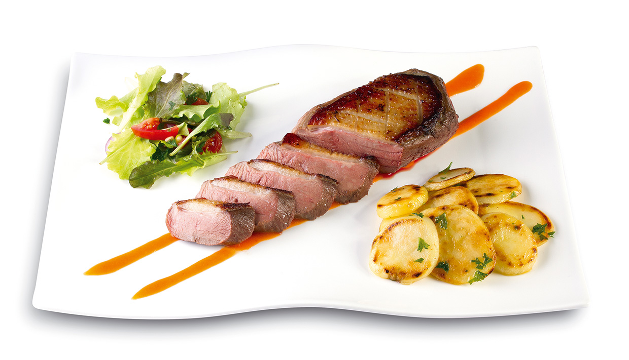 Duck breast with its Sunburst Orange coulis, side dish of Salardaise fried potatoes and garden salad